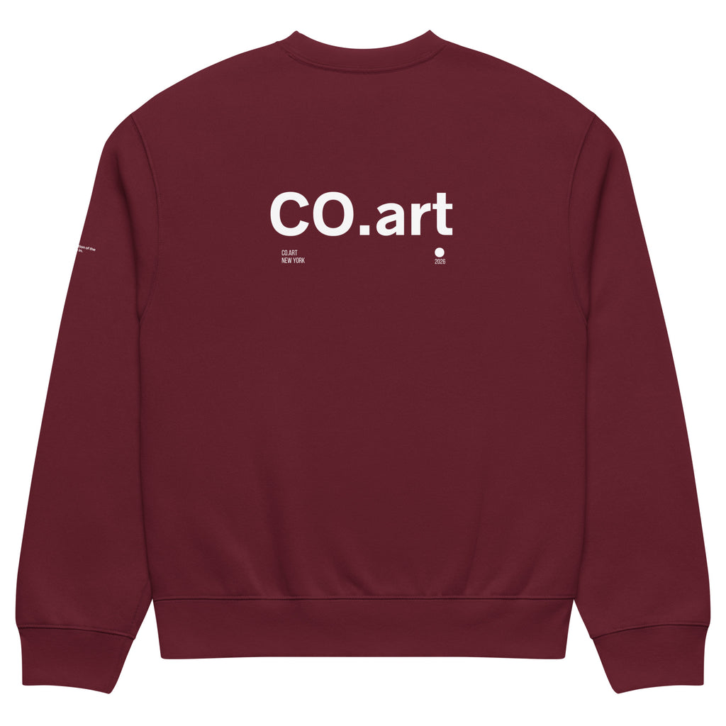 Felpa oversized color granata con scritta bianca "co.art" sul retro, stile streetwear con grafica manifesto e messaggio forte.